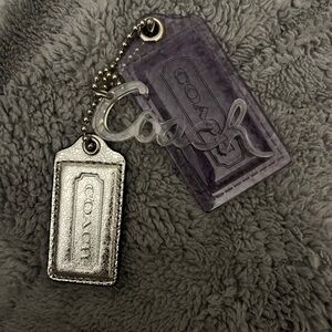 BRAND NEW ‼️Three Coach tags, one silver, one see-through, purple, word Coach